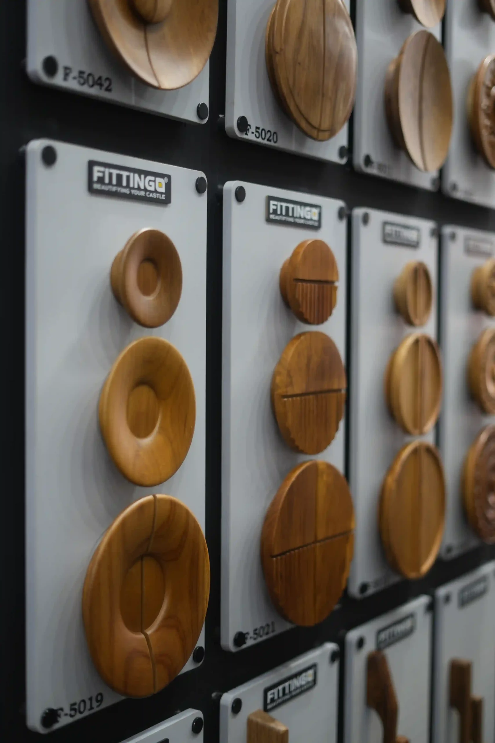 oval wooden knobs and pulls arranged on numbered Fittingo sample plaques