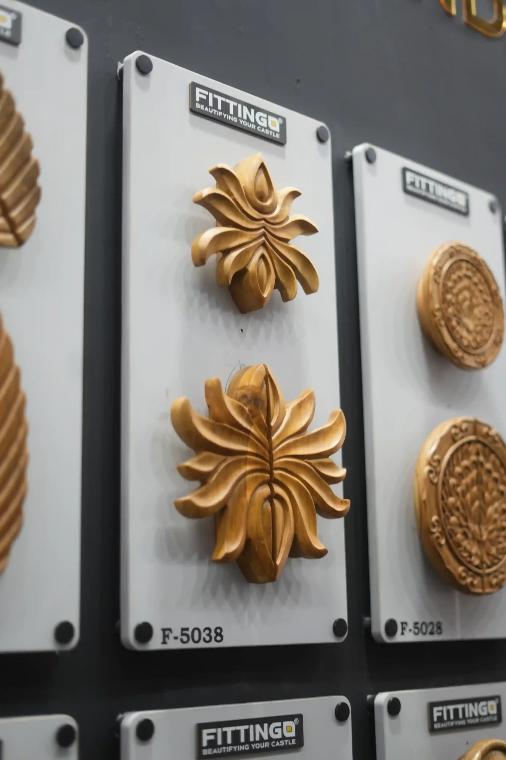 macro of hand-carved floral wooden onlays on a Fittingo sample plaque